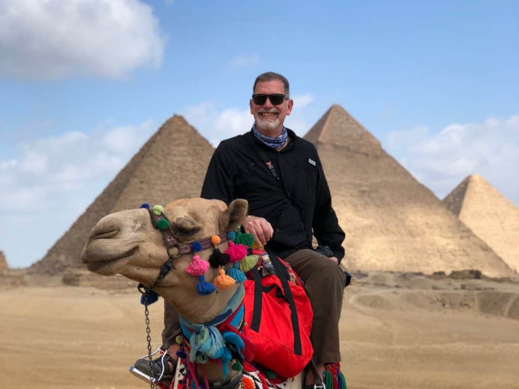 Jonathan Look, Jr. on a camel in Egypt Enjoying retirement travel