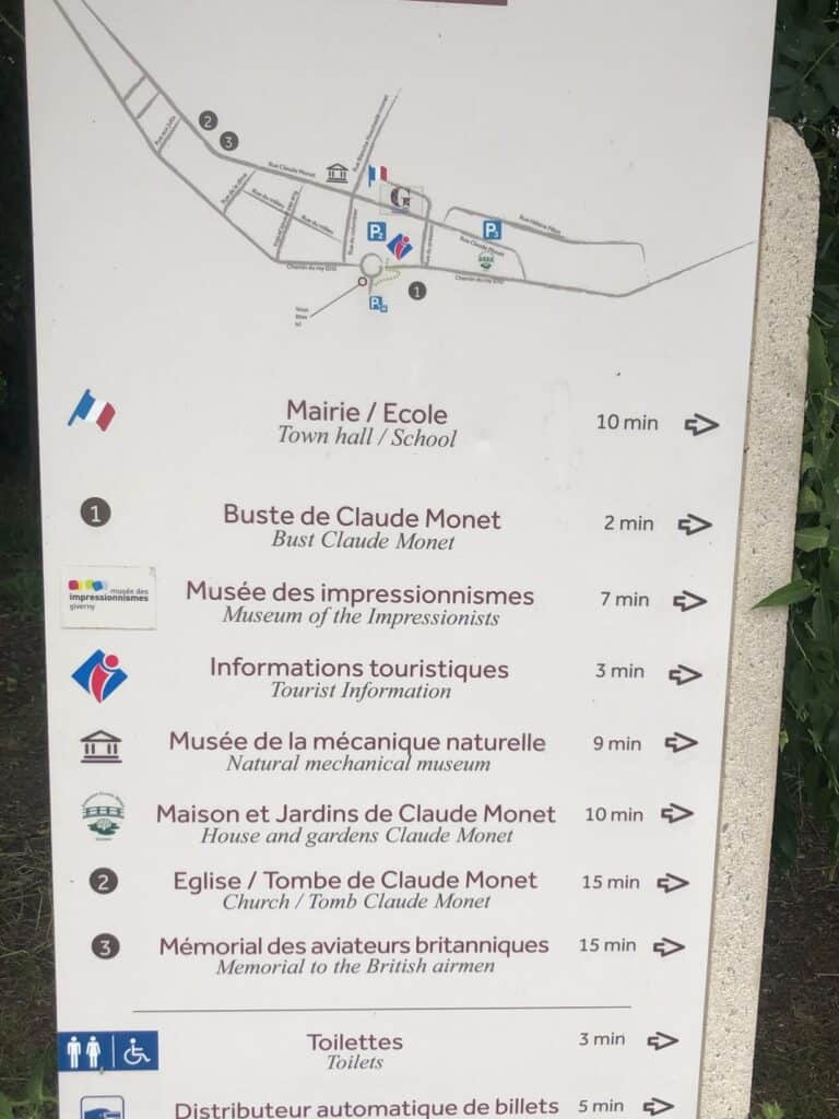 Signpost in English and French leading you to Monet's Garden Giverny
