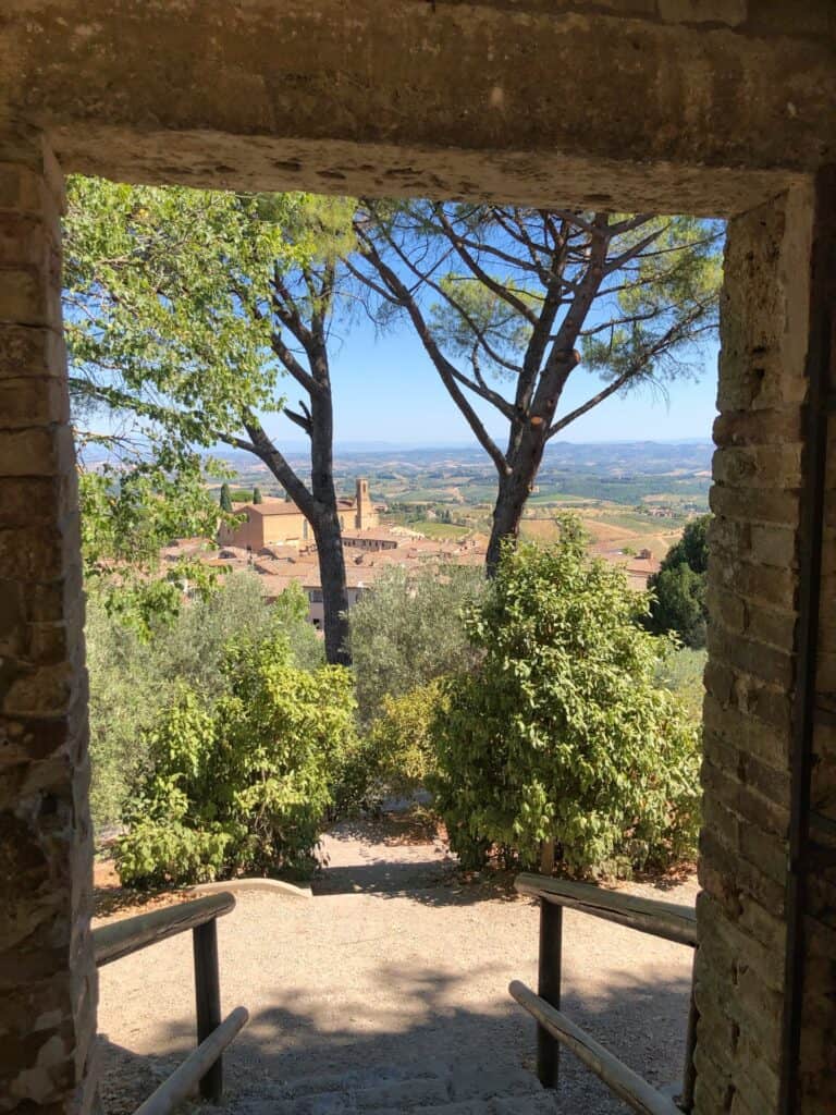 A view through a gateway on San Gimignano on a day trip with Viking Ocean Cruises from Barcelona to Rome