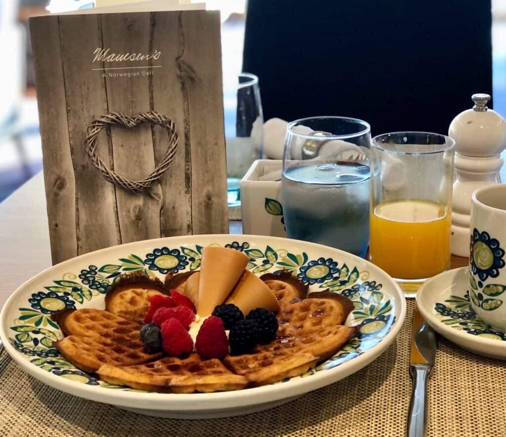 Breakfast waffles with fruit, orange juice and coffee at Mamsen's