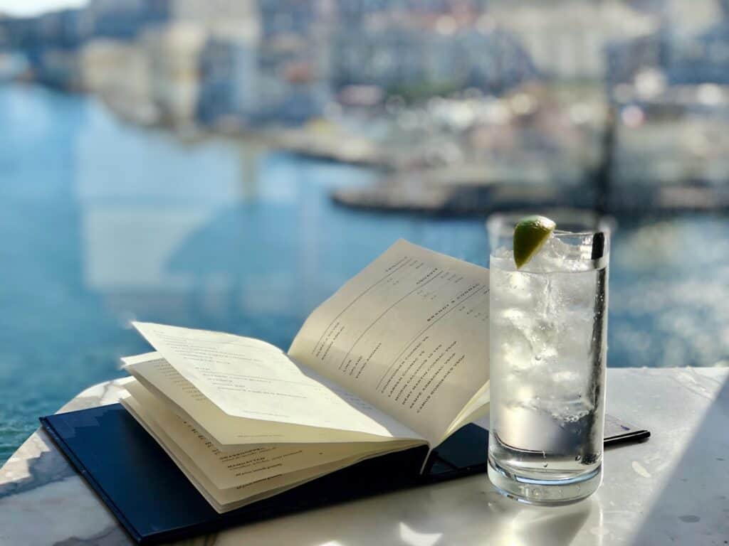 A gin and tonic and a book in the Explorers' Lounge on board the Viking Sky.