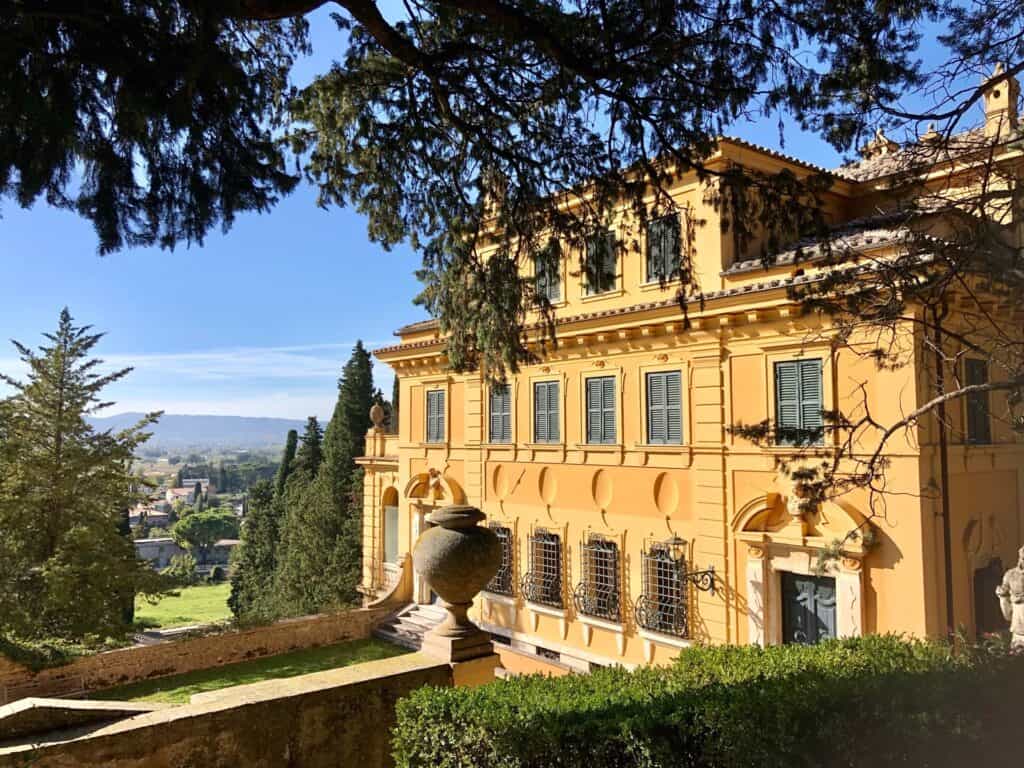 The yellow facade of Villa Fidelia located just outside Spello Italy. 