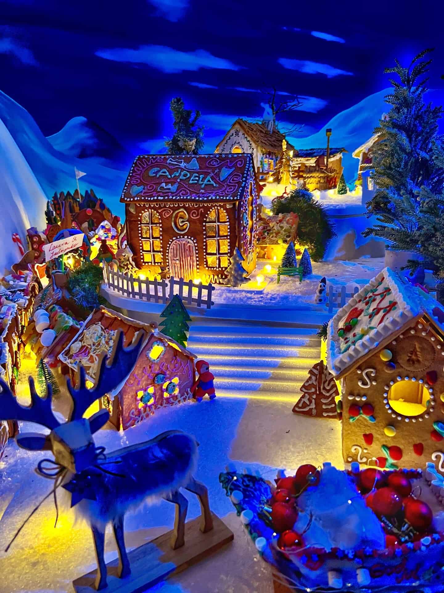 Gingerbread bread town with a reindeer and gingerbread houses at Gingerbread Town (Pepperkakebyen)
