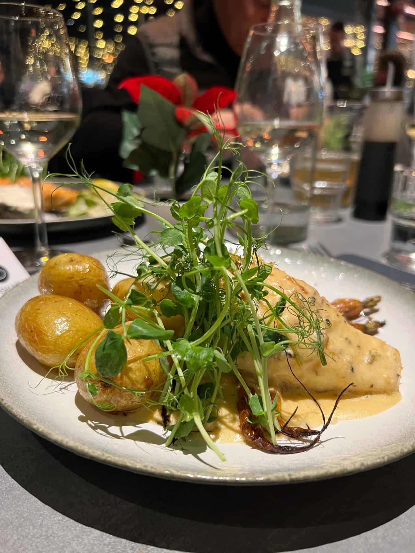 Baked halibut, greens, and roast potatoes. Dinner at fish Me in Bergen