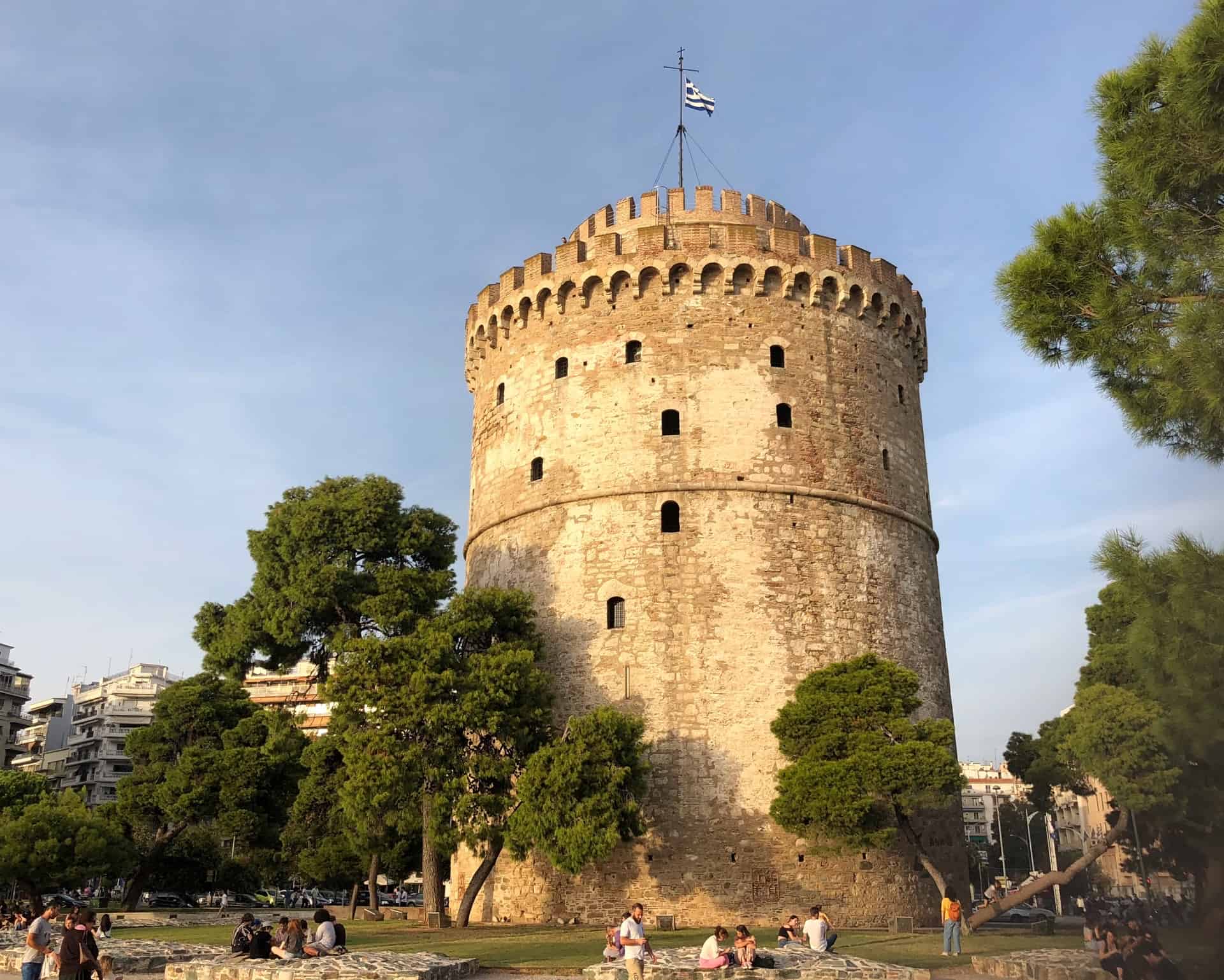 The iconic White Tower in Thessaloniki surrounded by trees 