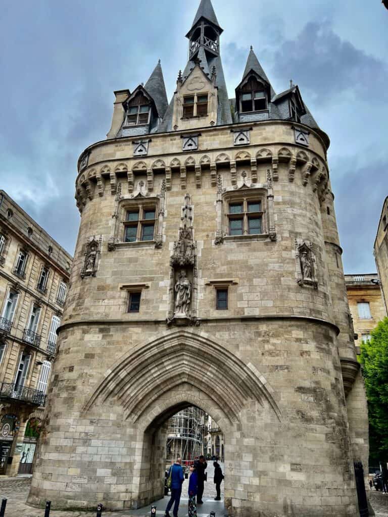 The Beautiful ancient Porte Caihou with archway, windows and turrets. Is Bordeaux worth visiting?