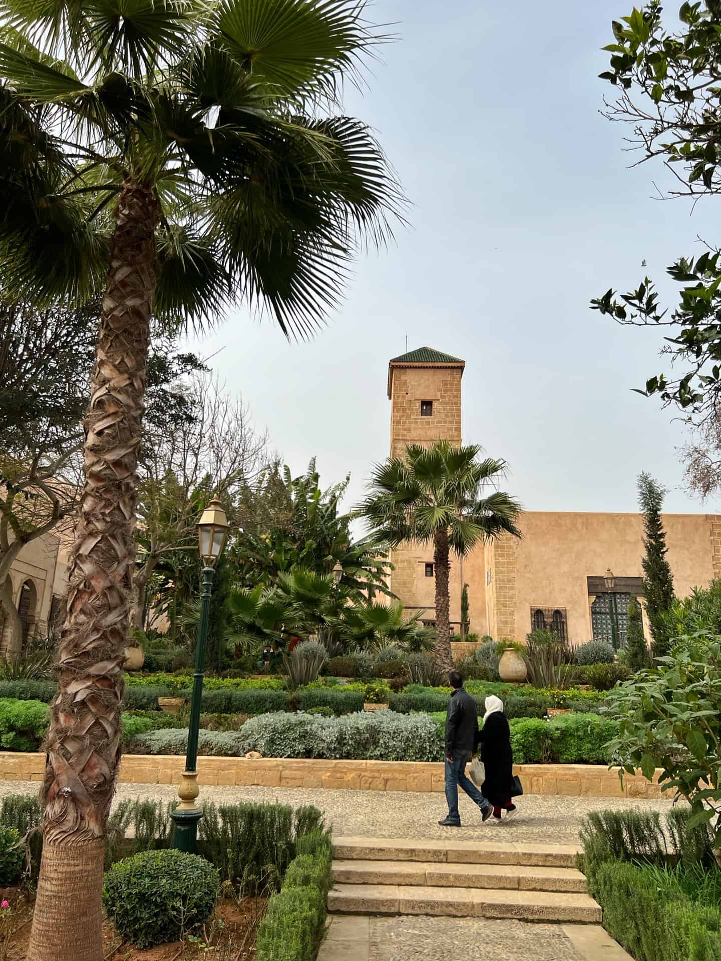 Couple walking in the Andalusian Gardens in Rabat