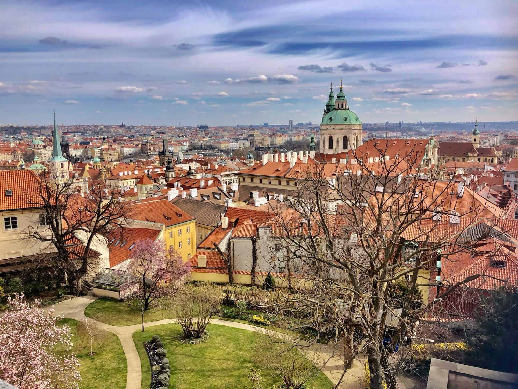 A view of the old city of Prague from the castle gardens. Park in foreground.