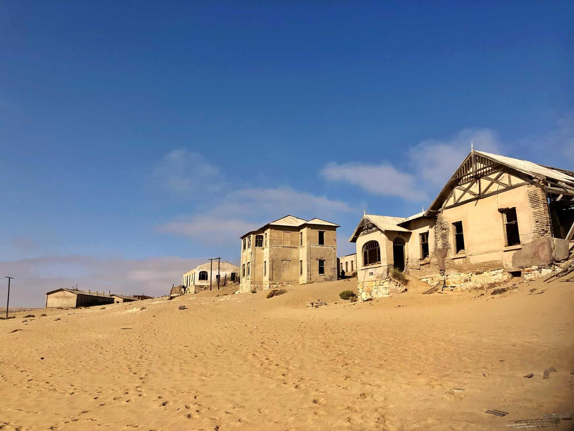 Crumbling houses and sand are all that remains of the main street in Kolmanskop