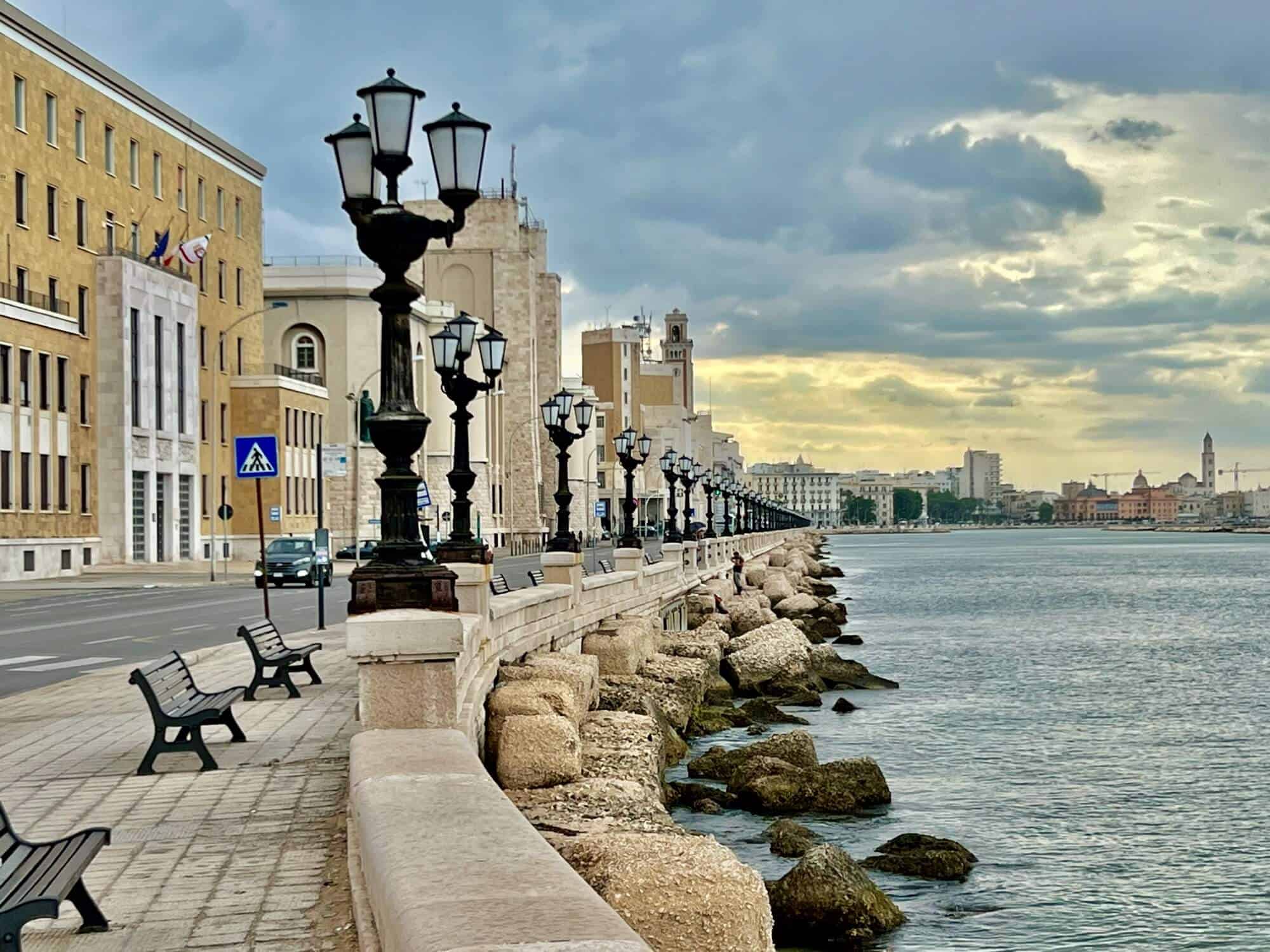 The promenade in Bari with lampposts, benches and facist era buildings. 