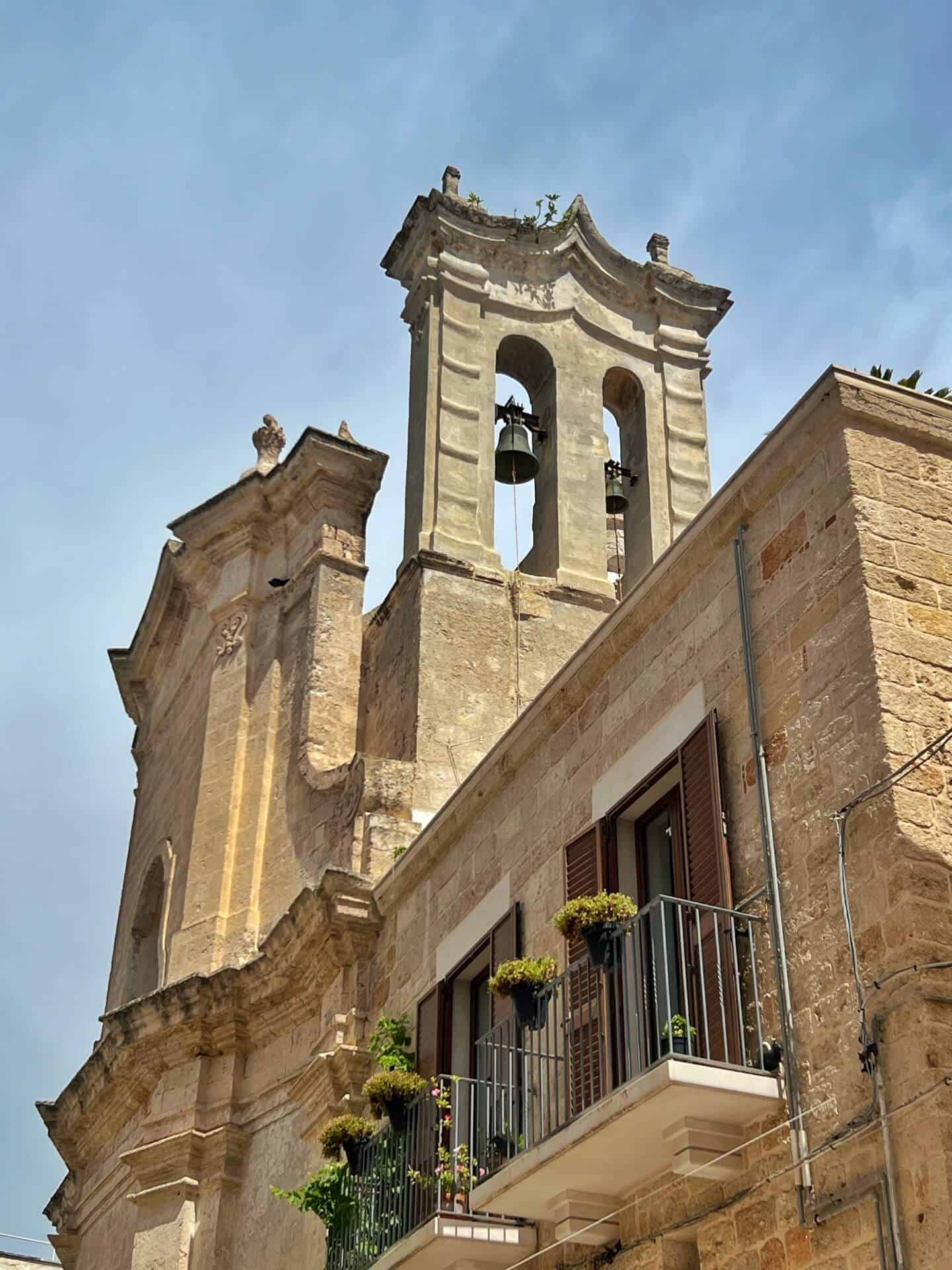 The bell tower of Chiesa Matrice, the town's principal church in Polignano a Mare 