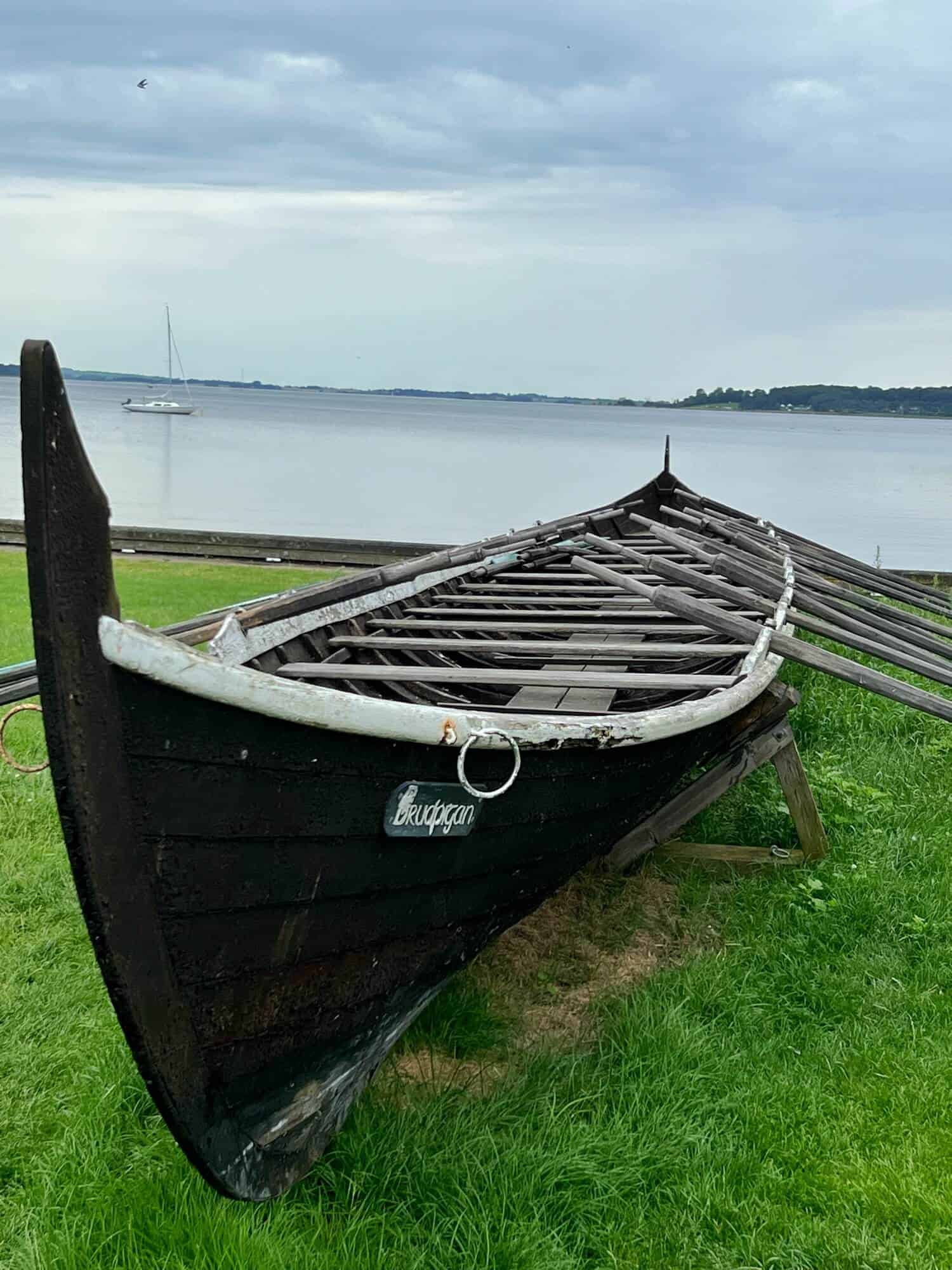 A viking ship with oars by Roskilde fjord by the Viking Ship museum