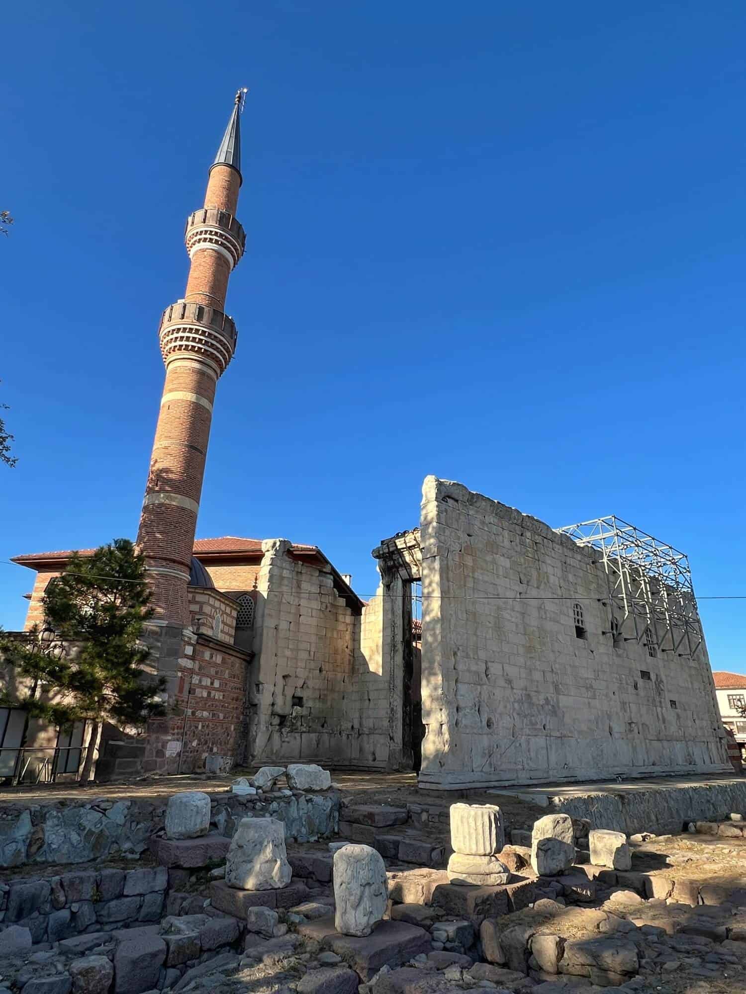 The ancient ruins of Temple of Augustus next to the minaret of the Hacı Bayram Veli Mosque