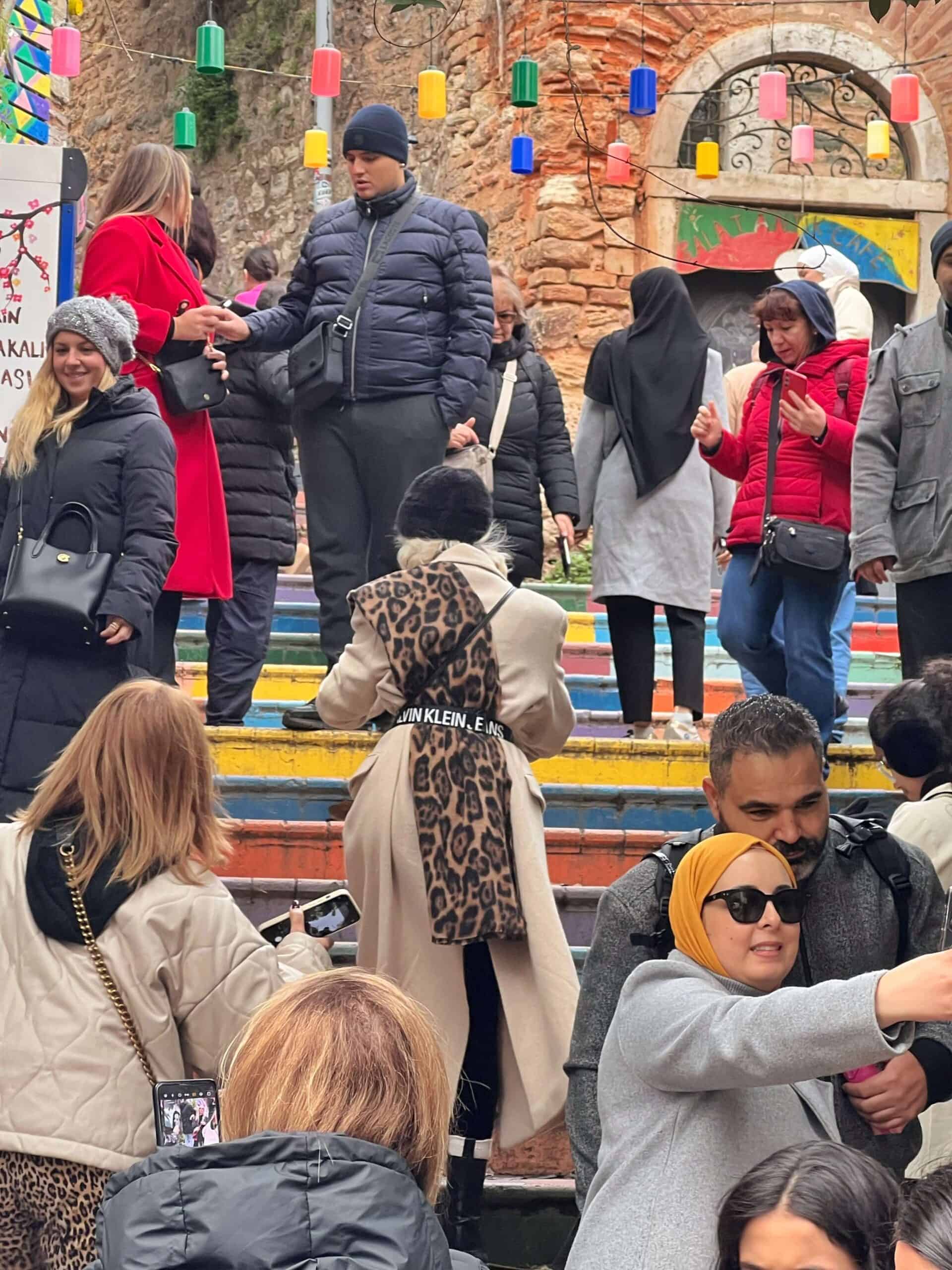 crowds of people taking photos on Fener's painted steps 