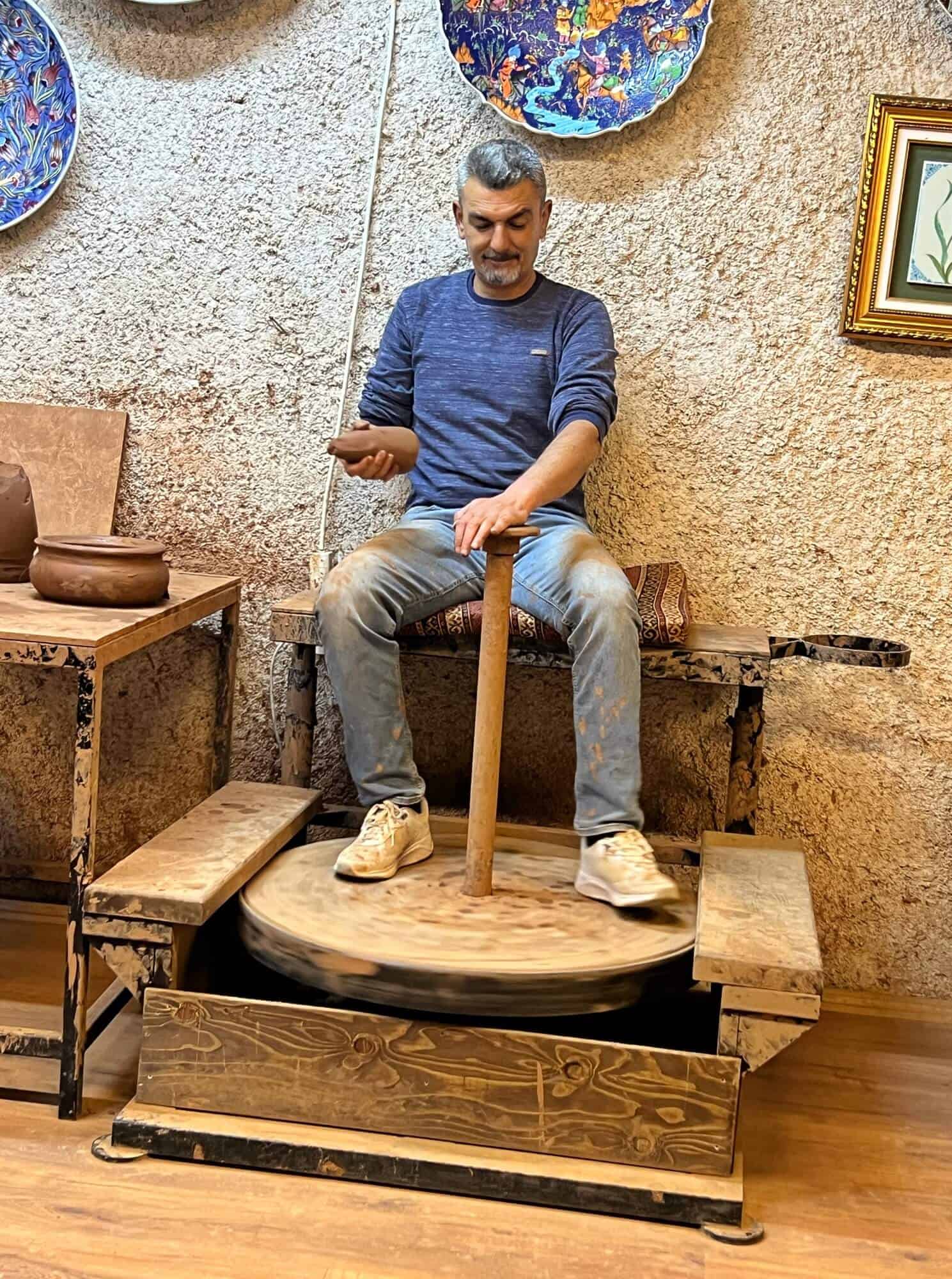 A man making pottery the traditional way 
