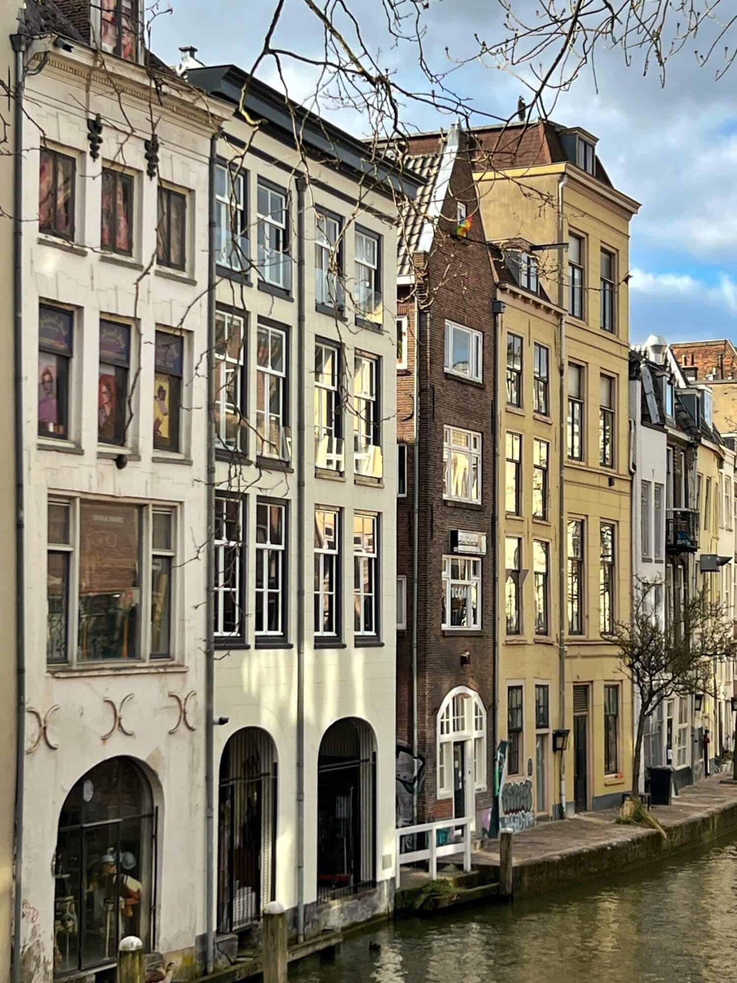 Tall narrow houses by canal in Utrecht