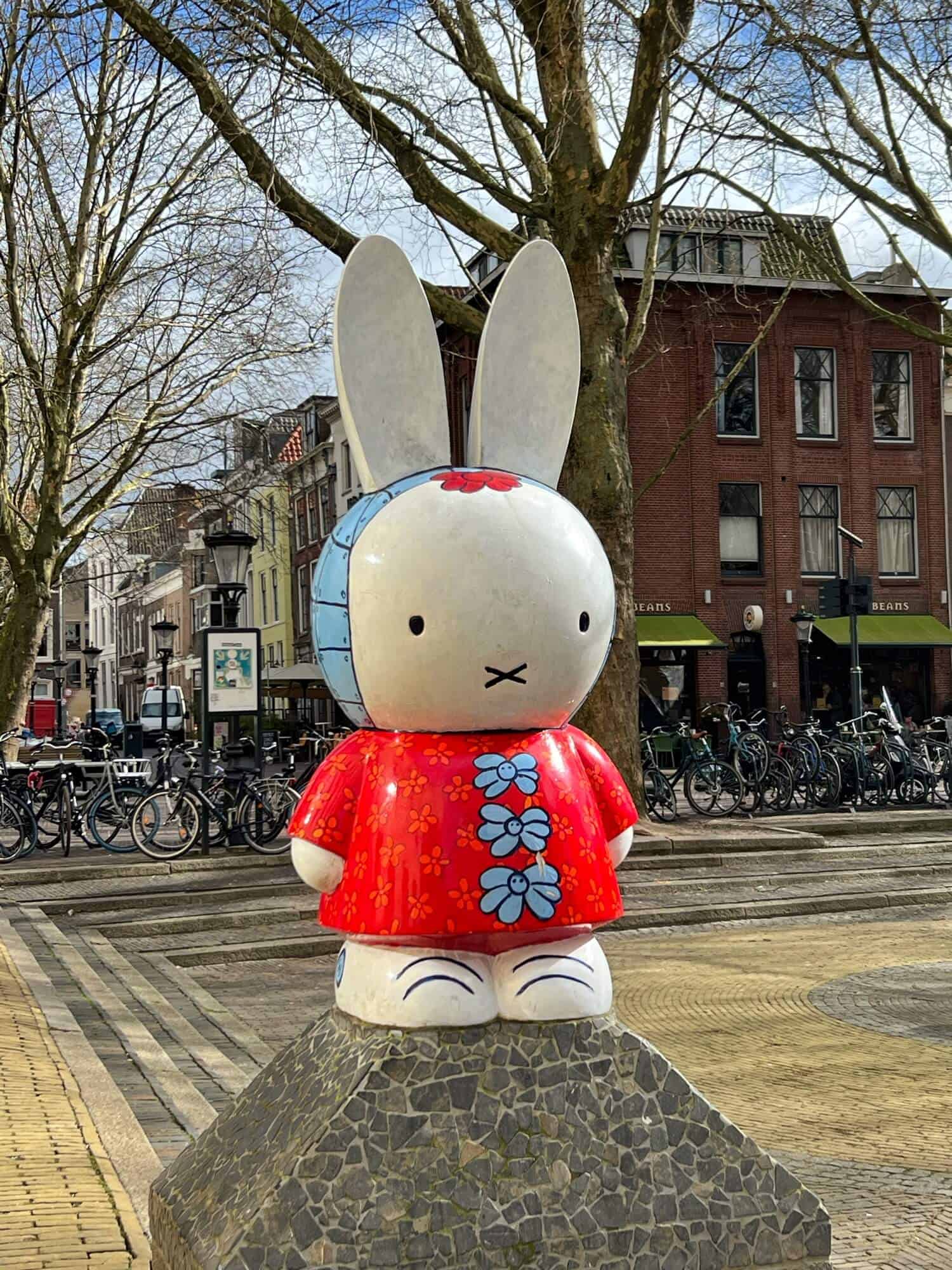 Miffy, the children's book character in a red dress with blue flowers