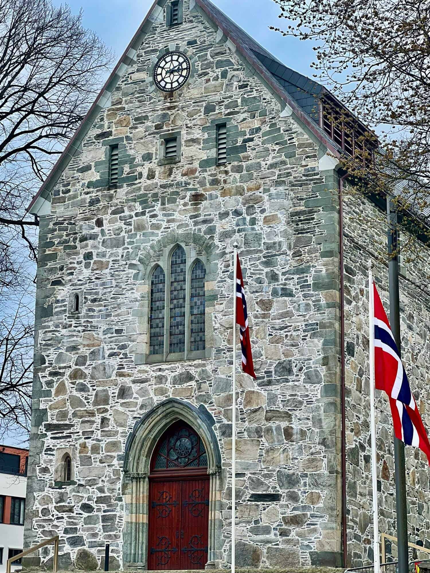 Stavanger Cathedral and two Norwegian flags