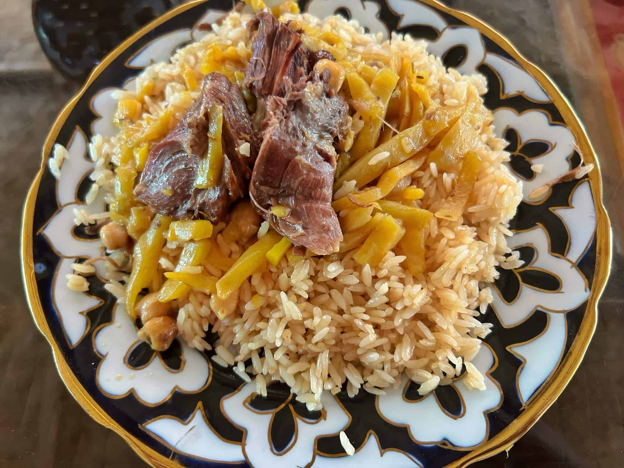 Local dish Plov made with rice and lamb 