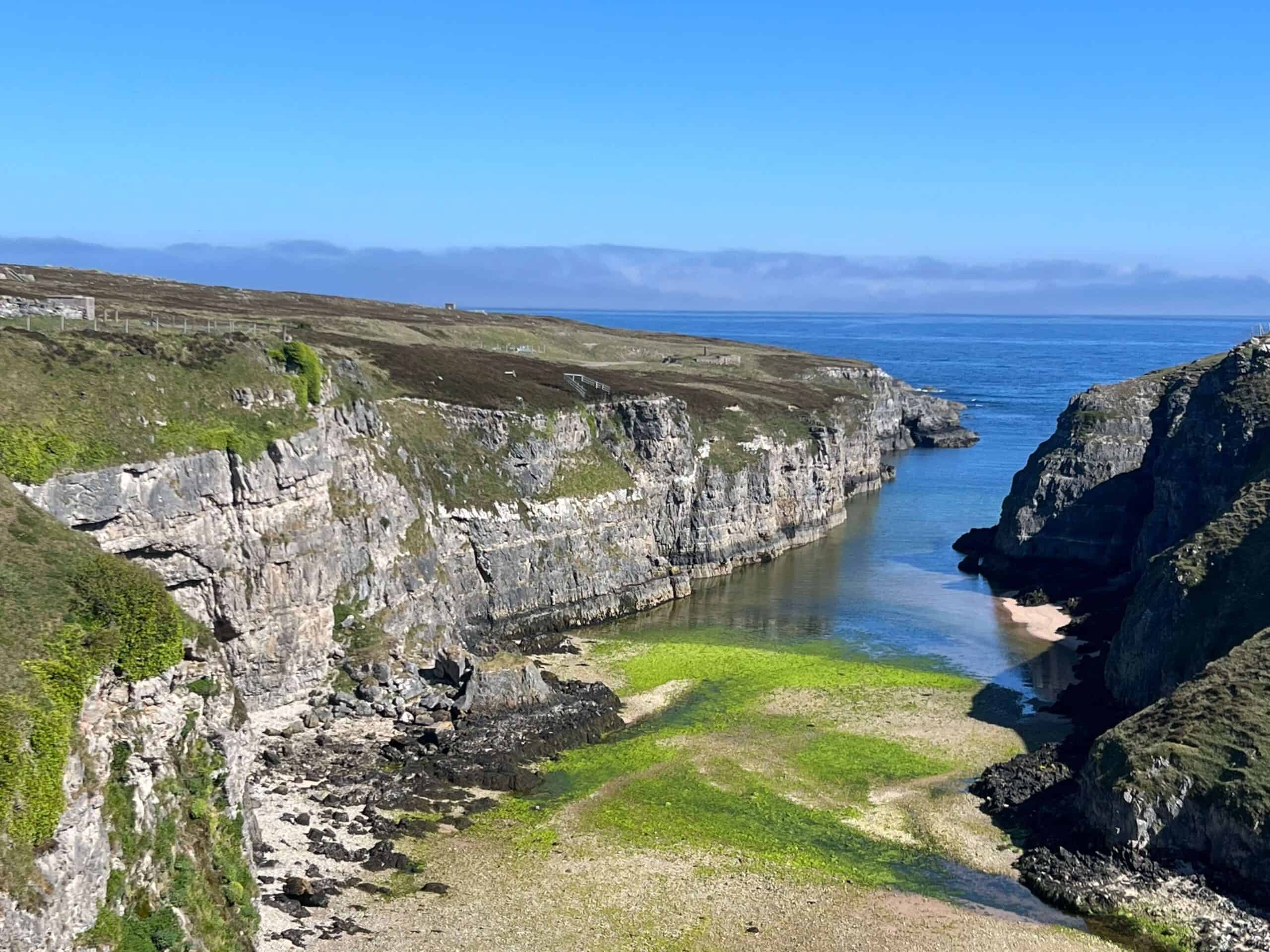 Cliffs and beach by Smoo Cave 