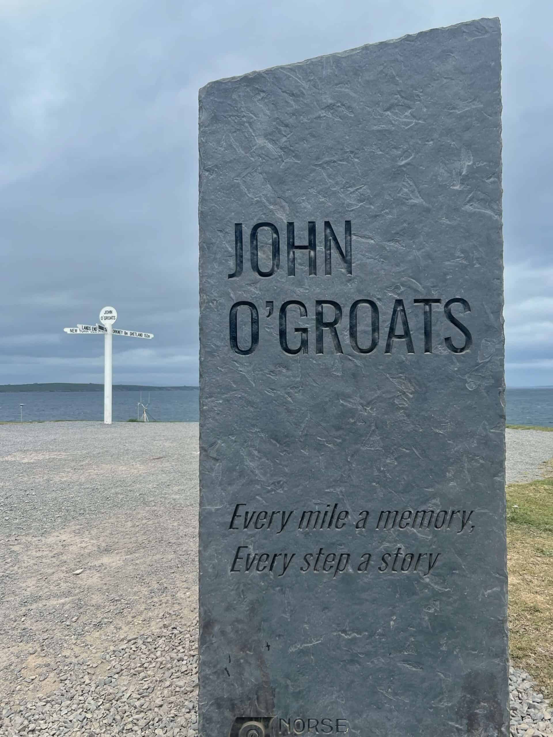 Sign post at John O Groats saying every mile a memory, every step a story. 