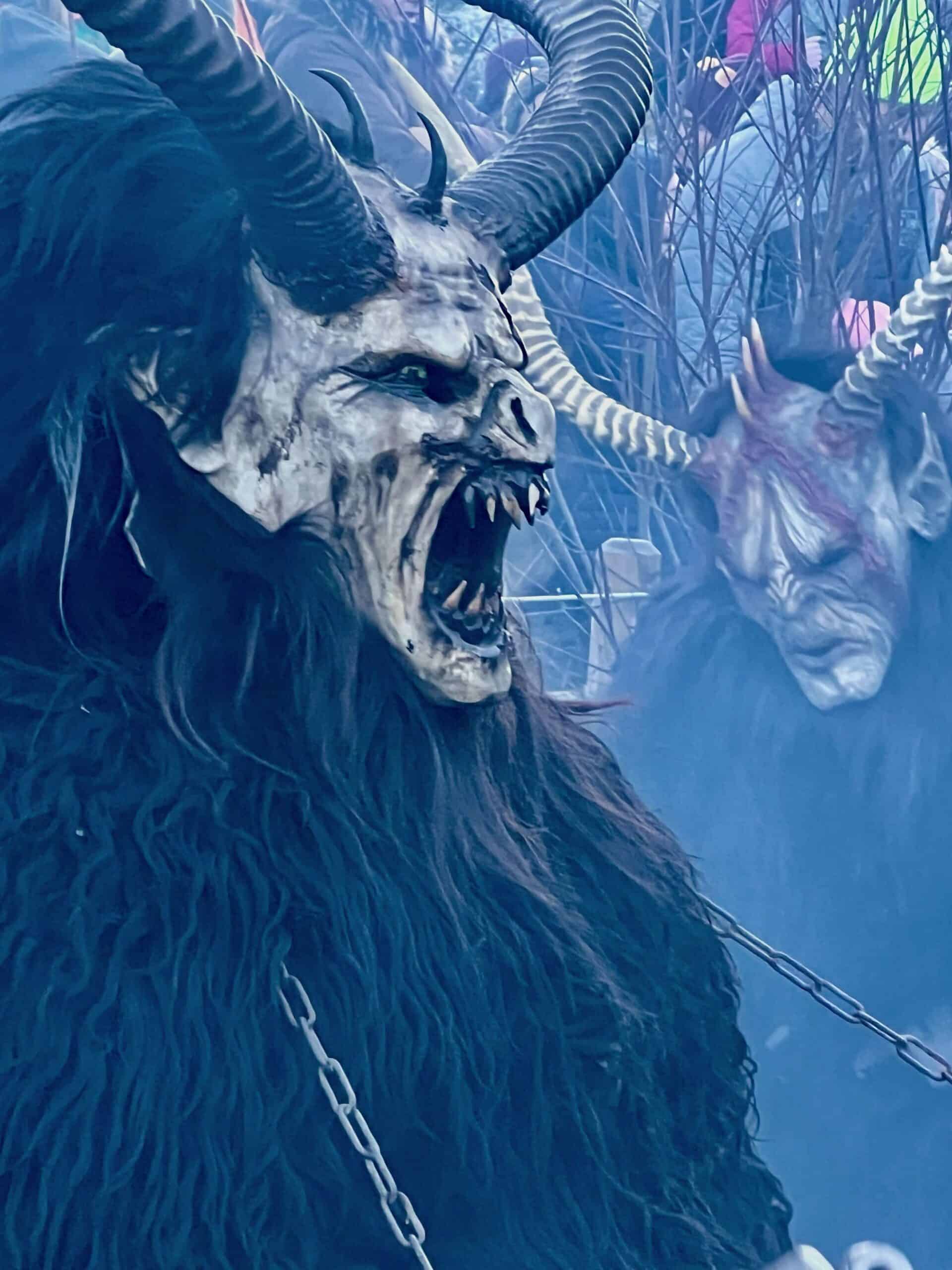 Krampus with open mouth and pointy teeth