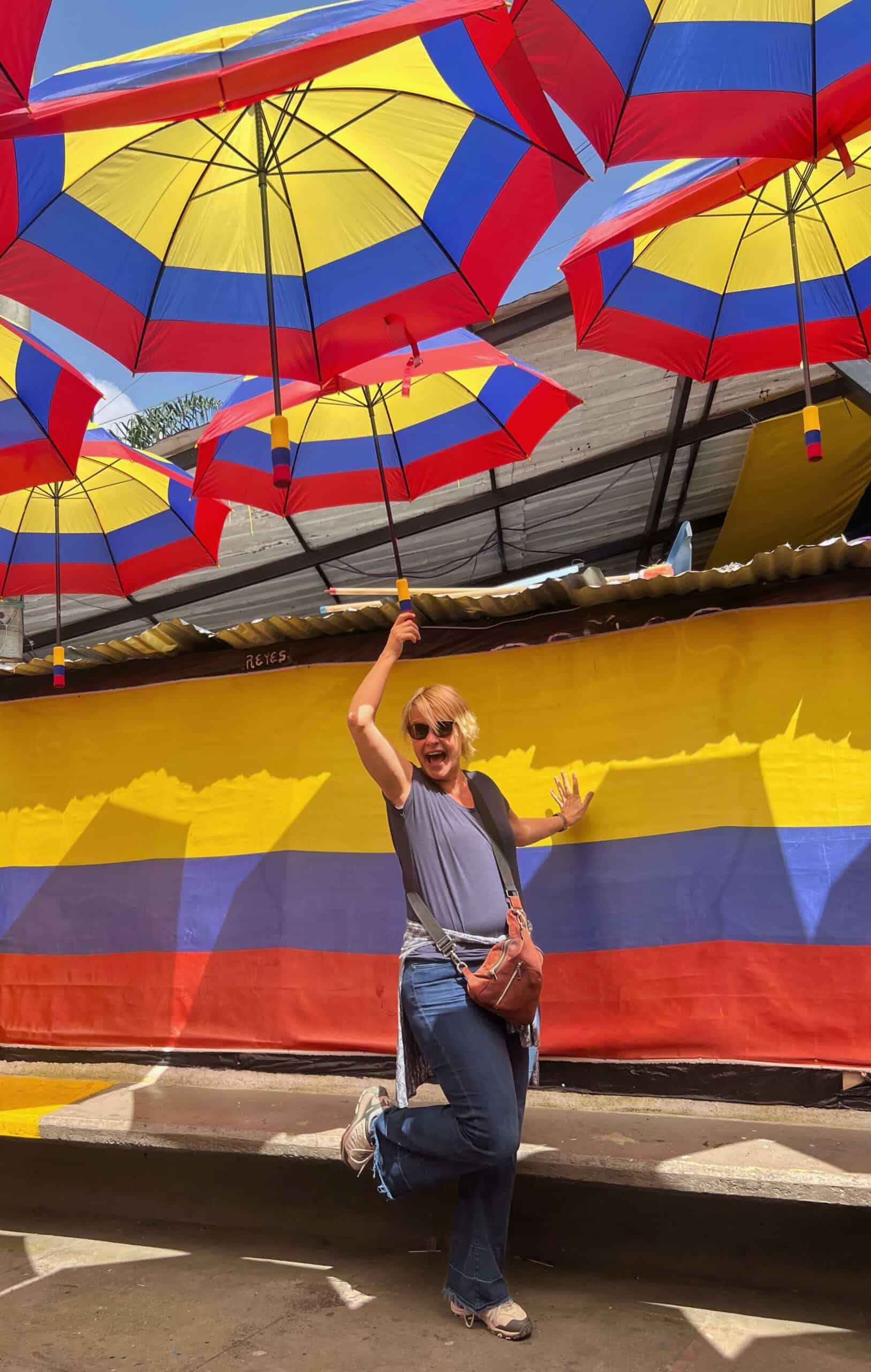 Lady under umbrellas in Colobian colours 