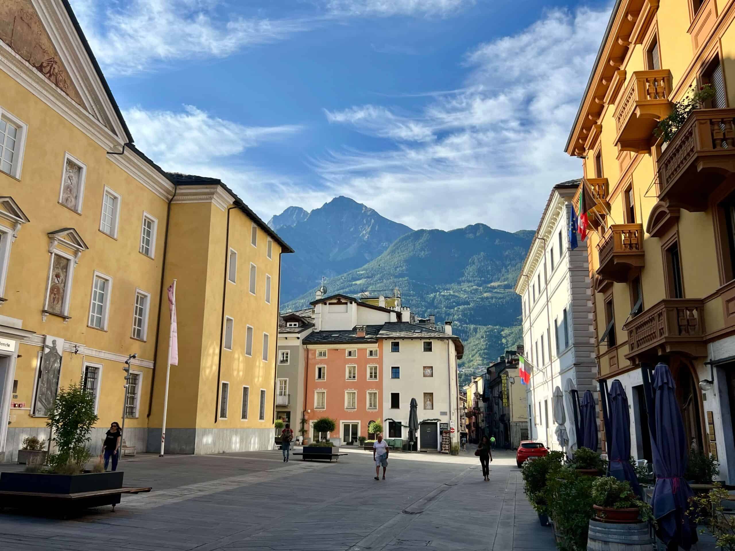 Historic town of Aosta with mountains in background 