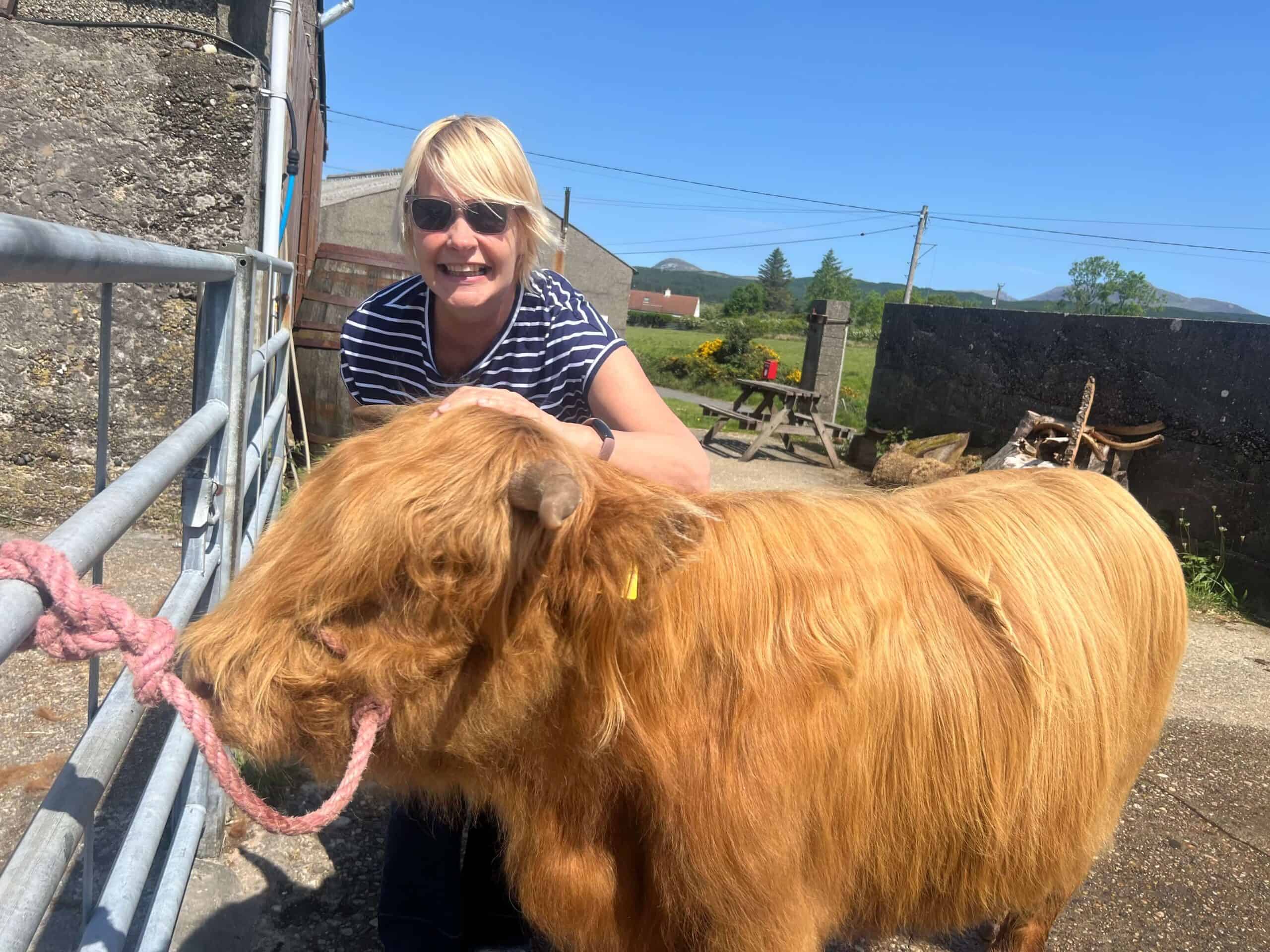 Sarah with Charlie the highland Coo