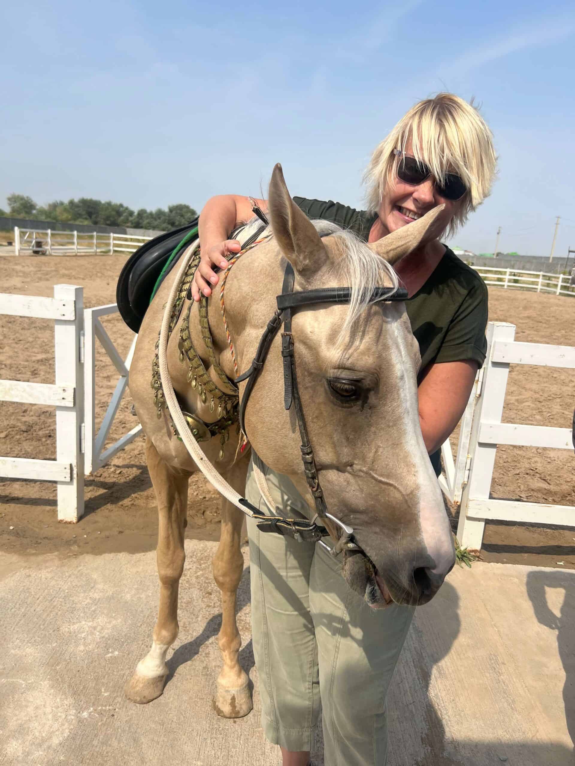 Me cuddling an Akhal-Teke horse 